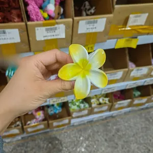 Close-up of frangipani hair claw clip with yellow and white gradient matte finish petals