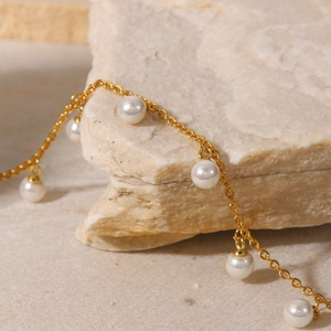 French style 18K gold plated stainless steel anklet with white pearls on a natural stone