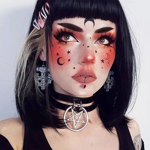 Gothic accessories set with O.M.G hair clip, leather star choker, and cross earrings