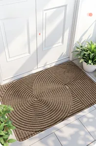 Nahaufnahme der braunen PVC-Schlingenmatte mit Doppelspiralstruktur zur Schmutzentfernung