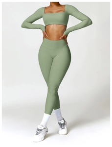 Close-up of sage green yoga set featuring long sleeve square neck crop top and high waist pants