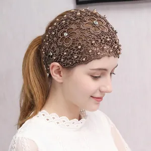 Brown hollow lace headband with pearls and rhinestones on female model