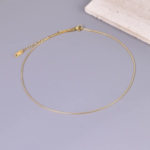 Detail of 18K gold rose finish snake chain necklace with K18 hallmark and clasp
