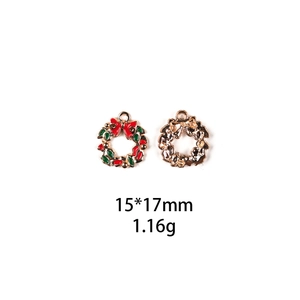Detail of 15x17mm Christmas wreath alloy charms with red green enamel and gold finish