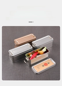 Detail of vintage rectangular tin boxes with metal latches in silver and bronze finish