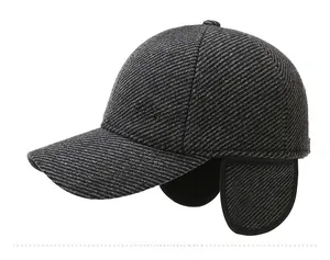Detailed view of winter baseball cap with ear flaps and silver Sport Classic metal logo