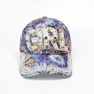 Detail of floral baseball cap with G-I-R-L pearl and rhinestone lettering