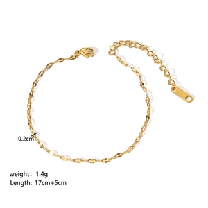 Detail view of gold stainless steel link bracelet with lobster clasp and extension chain
