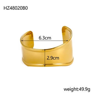 Detailed view of irregular golden wide open cuff bangle with size and weight info
