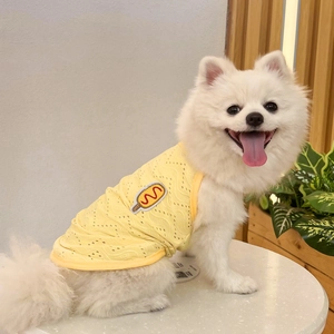 Close-up of yellow breathable mesh dog vest with hot dog cartoon embroidery