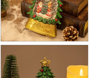 Close-up of a Christmas tree snow globe with Santa Claus, reindeer, and a gold vintage base