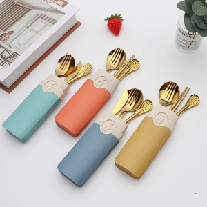 Portable stainless steel cutlery set with golden spoon fork and chopsticks in colorful cases