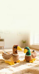 Detailed close-up of a pair of plush mandarin duck dolls with realistic soft textures