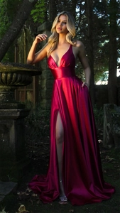 Detail of dark red satin dress with V-neck, high slit and functional pockets