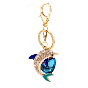 Golden dolphin keychain with sparkling crystal rhinestones and blue enamel details