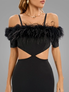 Detail of black off-shoulder dress featuring premium feather trim and waist cut-outs