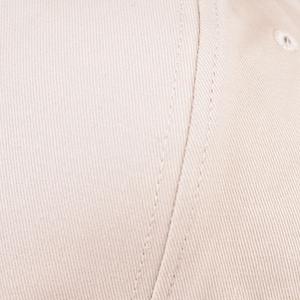 Macro shot of cotton leopard baseball cap fabric with reinforced stitching and eyelet