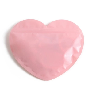 Pink heart-shaped resealable plastic gift bag with glossy finish on a white background