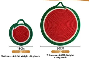 Detail view of round watermelon pattern woven placemats in 18cm and 30cm sizes