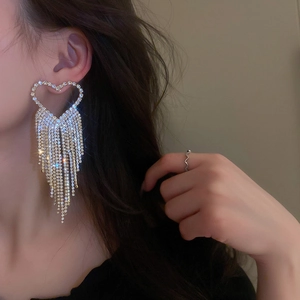 Exaggerated heart tassel drop earrings featuring sparkling rhinestones on gold metal base