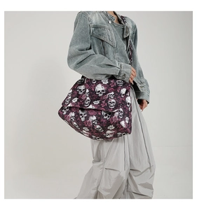 Close-up of gothic skull and purple rose print on a large capacity nylon tote bag