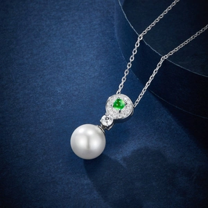 Elegant green agate and white pearl pendant necklace with sparkling crystal accents