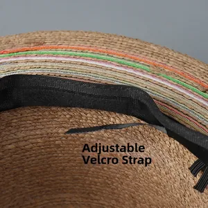 Detail view of adjustable velcro strap and woven straw texture inside the flat top sun hat