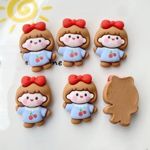 Detailed view of DIY resin craft charms in cartoon girl design for phone cases