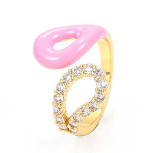Detail of 18K gold ring featuring pink enamel and micro-pave zircons on a white background