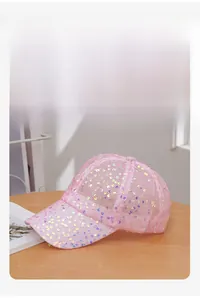 Detailed close-up of pink breathable mesh baseball cap with sparkling colorful sequins