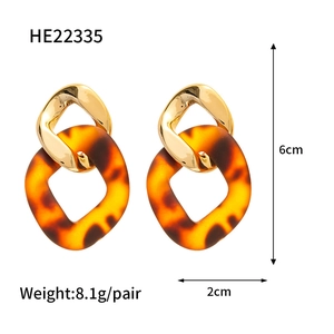 Detail view of retro acrylic leopard earrings showing dimensions 6cm by 2cm and weight