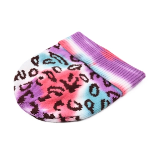 Flat lay view of a tie-dye knit beanie with pink and blue hues and leopard pattern