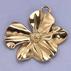 Detailed macro view of 304 stainless steel gold flower pendant with polished surface