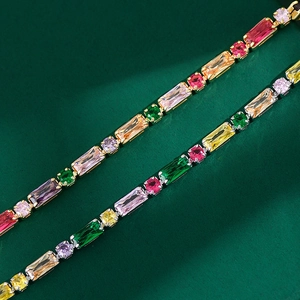 Colorful zircon tennis bracelet in gold and silver settings with vibrant square gems