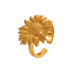 Detailed close-up of a gold sunflower ring with textured petals and adjustable band