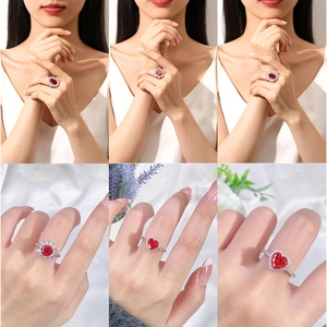 Luxury S925 sterling silver ring with heart-shaped red gemstone and sparkling floral accents