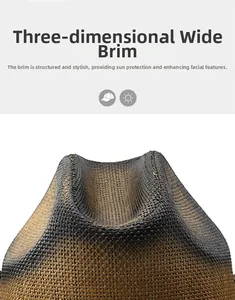 Detailed view of wide-brimmed straw hat with black to brown gradient woven texture