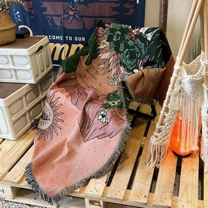 Bohemian woven camping blanket with cactus patterns and decorative fringe tassels