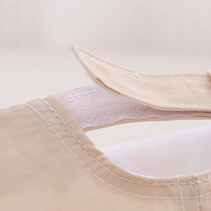 Detail of adjustable Velcro strap and reinforced stitching on baby sun hat