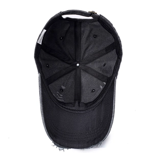 Inside view of a distressed vintage cotton baseball cap with ripped details and sewing