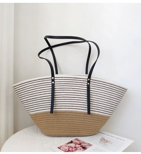 Close-up of cotton rope weave texture and black shoulder straps on the beach tote bag