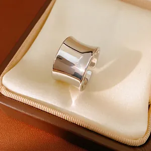 Minimalist wide concave silver ring with polished finish and adjustable open design