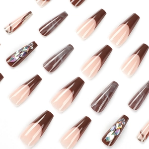 Long ballerina press-on nails with brown marble patterns and colorful rhinestones