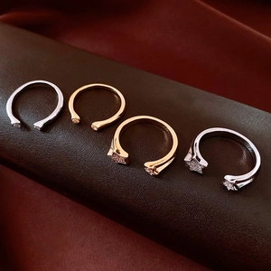 Adjustable 18k gold star rings with micro-pave crystals on premium leather background