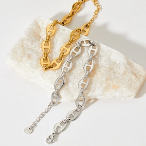 Gold and silver stainless steel pig nose link chain bracelets set on white stone