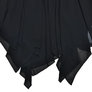 Detail shot of sheer black chiffon dress with asymmetrical layered hemline structure