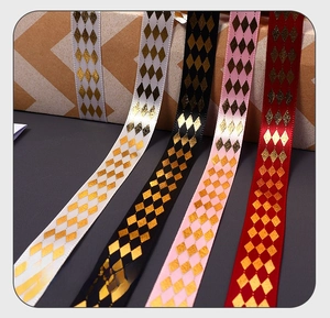 Detail of four-color ribbon set with foil stamped diamond patterns for gift wrapping