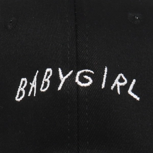 Black baseball cap with white BABYGIRL embroidery, casual unisex streetwear style