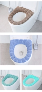 Detailed knit texture of thick O-shaped toilet seat covers in various pastel colors