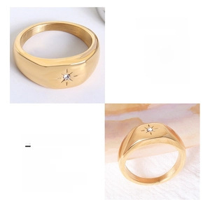 Détail d'une bague en titane plaqué or 18 carats avec motif étoile et zircon